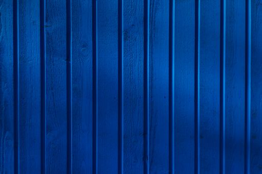 A closeup shot of weathered blue wood texture