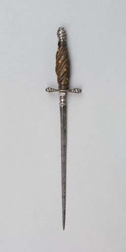 A vertical shot of an antique rusty sword