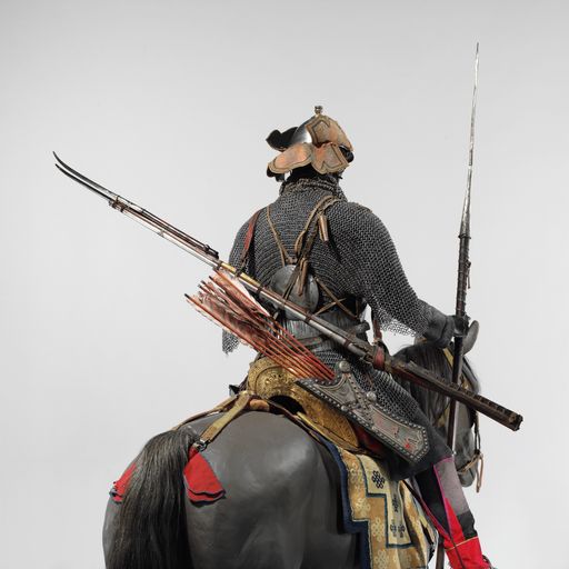 Ancient samurai armor on a horse figurine isolated on gray surface background