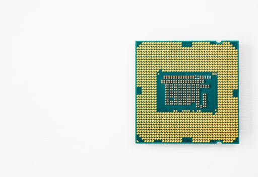 A closeup of a computer microprocessor isolated on a white background