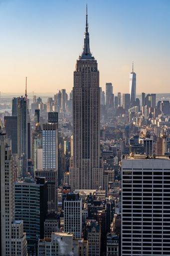 A vertical shot of the sunrise over the Empire State Building in New York City
