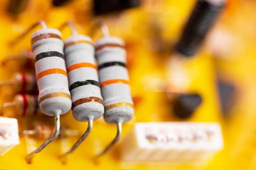 A close-up shot of components and microchips on the old PC circuit board.