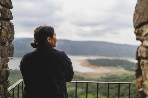 A view of a beautiful woman traveling in the streets of a small, cute town in Spain