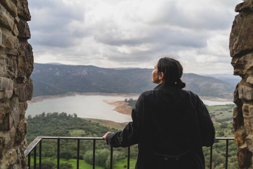 A view of a beautiful woman traveling in the streets of a small, cute town in Spain