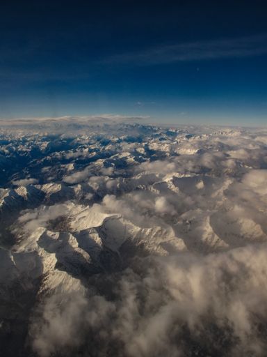 A beautiful view of snowy mountains in a daylight