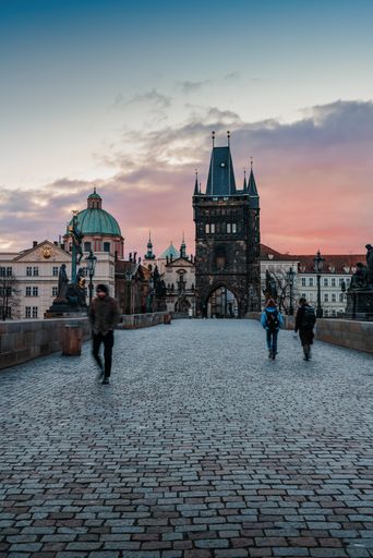 A vertical sunrise sky over Vltava River and the Old Town of Prage