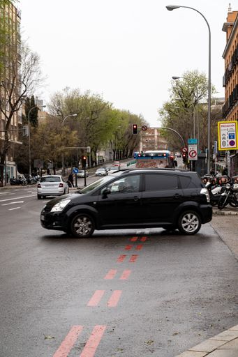 Madrid, Spain. March 18, 2022. Vehicle crossing the red line indicating the boundary of Madrid 360, formerly Madrid Central.