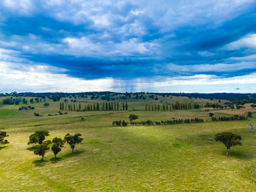 An aerial view of fields and valleys at Wellington Vale, Australi