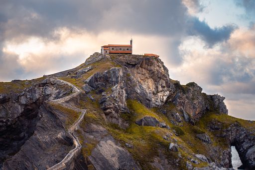 A beautiful view of a Gaztelugatxe Islet in Spain under the cloudy sky