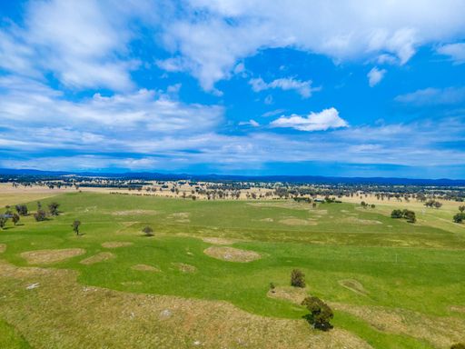 An aerial view of fields and valleys at Wellington Vale, Australia