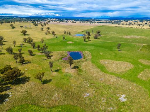 An aerial view of fields and valleys at Wellington Vale, Australia