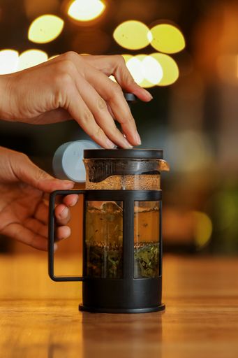 A vertical shot of tea in a French press
