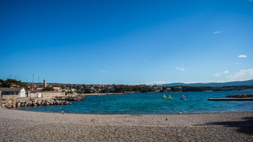 A beautiful view of a beach in Krk Island, Croatia under the clear sky