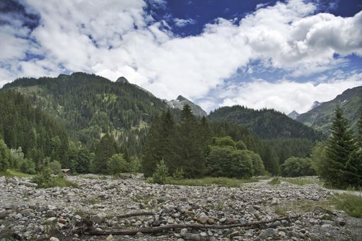 A mesmerizing shot of the beautiful landscape of the green mountains under a cloudy sky
