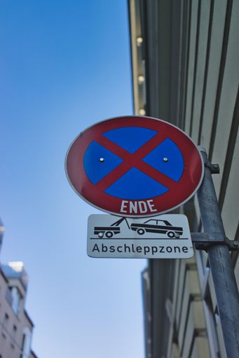 A vertical low angle shot of the parking ban sign in Austria