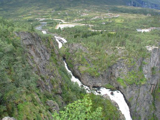 An aerial summer view of the Voringsfossen waterfall surrounded by forests in Norway