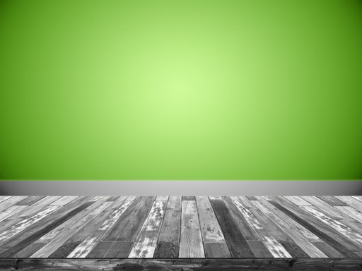 An illustration of an empty room with a grey wooden floor and a green wall