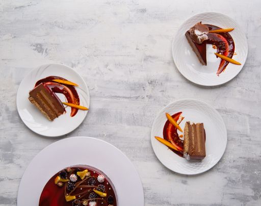 A top view of slices of tasty cake on white plates