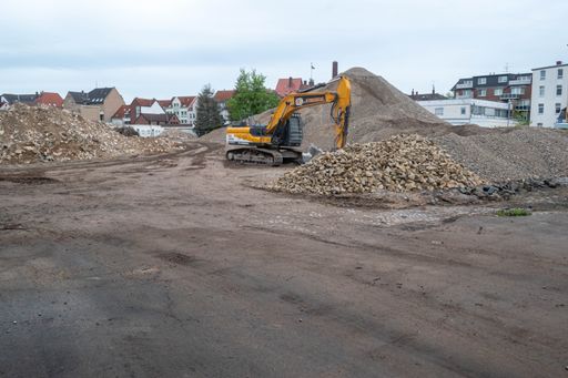 A demolition excavator on a construction site