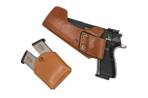 a closeup shot of pistol with leather sheath for quick removal on white background