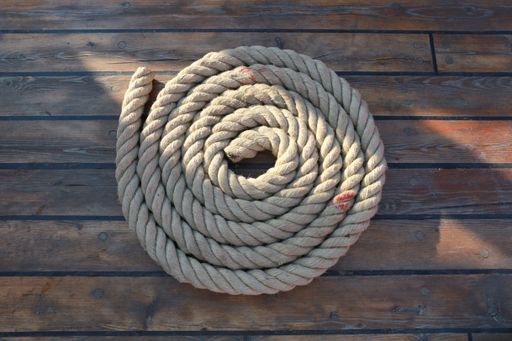 A top view of hemp rope on plywood surface
