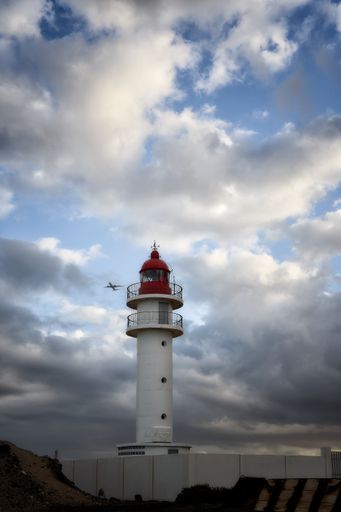 A vertical shot of the lighthouse on a cloudy day in Gran Canaria island, Spain