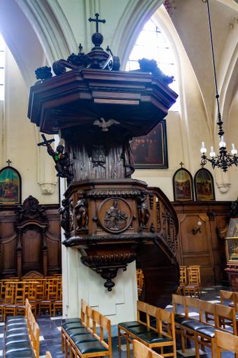 A vertical shot of the interior of St Nicholas church in downtown Brussell, Belgium