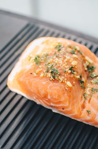 A closeup shot of a delicious salmon with seasoning