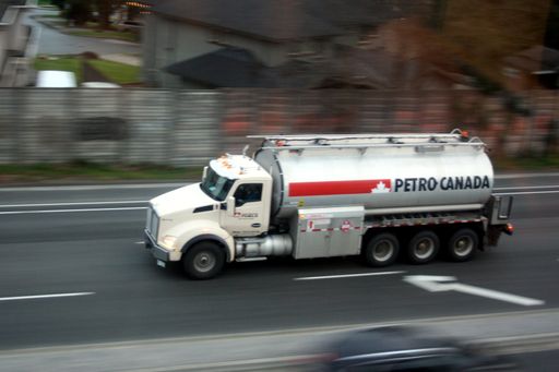 A truck with a container for gasoline, driving through the Burnaby