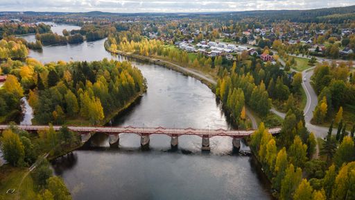 An aerial view of the Lejonstromsbron wooden bridge in Skelleftea, Sweden, crossing the Skellefte River