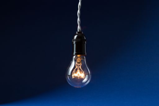 A closeup of a new generation led light bulb on a blue background