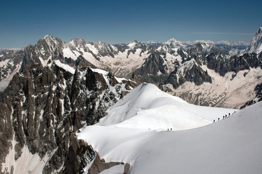 The magnificent mountains covered with snow  under the blue sky