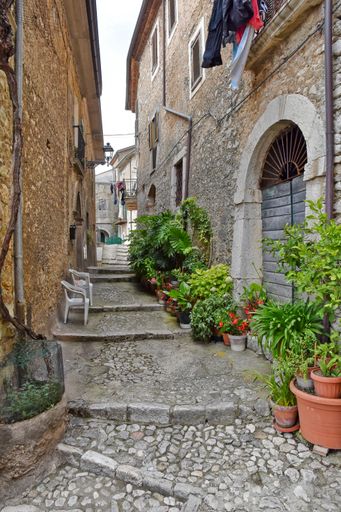 The vertical shot of a small street among the old houses of Arce, a medieval village in the Lazio region in Italy.