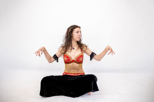 A Caucasian female dancer of Arabic dance in a studio