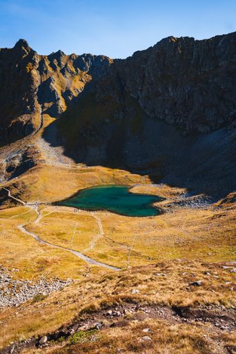 A vertical shot of Herzsee, Heart Lake and mountains. Hochjoch, Austria.