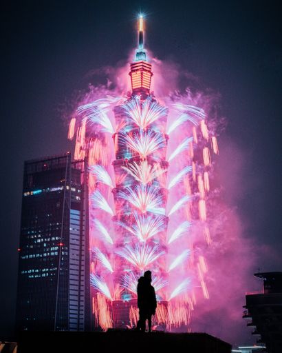 A beautiful scenery of colorful fireworks on the Taiwan Taipei tower at night