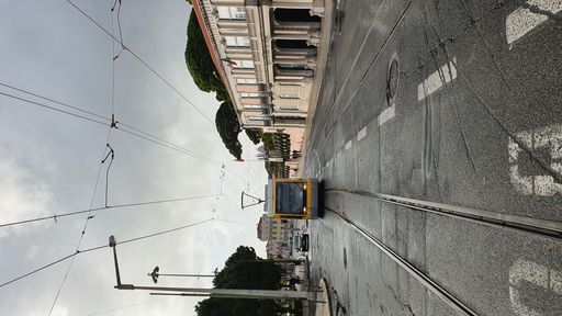 A beautiful view of a tram on a rail under the cloudy sky
