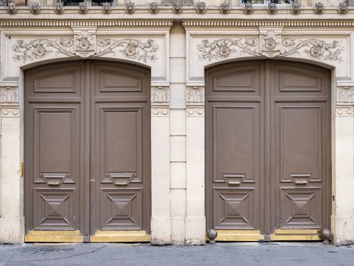 Paris, two ancient wooden doors, typical building in the 11e arrondissement