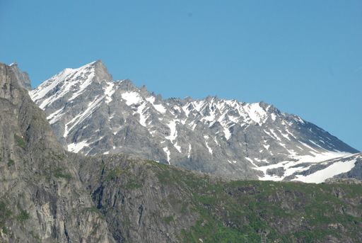 A beautiful view of snow-capped mountains under blue sky