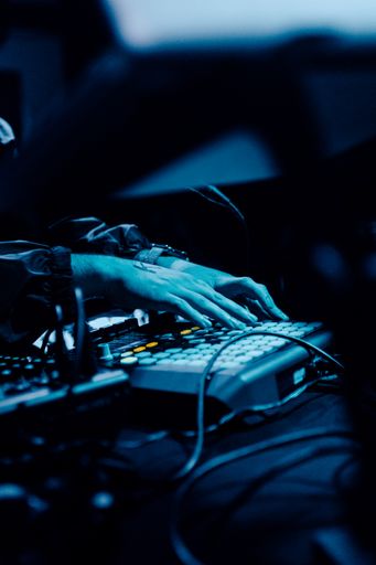 The DJ's hands on the beat pad during a performance at a nightclub in Florida