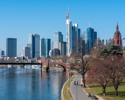 A beautiful view of an old bridge with a skyline background in Frankfurt am Main, Germany