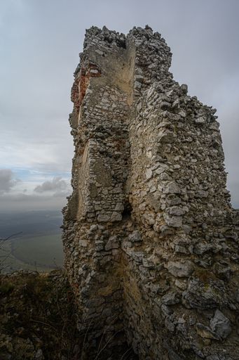A vertical shot of the ruins of Chachtice Castle in Slovakia on a gloomy day