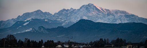 A panoramic shot of the snowy alps visible from Salzburg, Austria