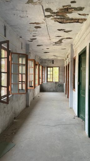 A vertical shot from the hallway of an old building