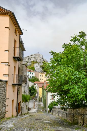 A vertical shot of a small street between the old houses of Pietrabbondante, a medieval town in the Molise region, Italy