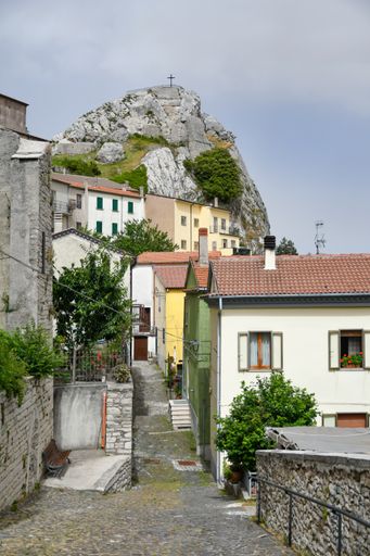 A vertical shot of a street between the old houses of Pietrabbondante, a medieval town in the Molise region, Italy