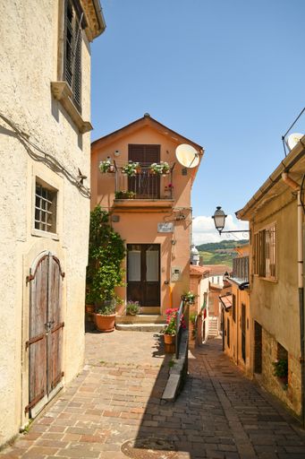 A narrow street among the old houses of Ruvo del Monte in a medieval village in the Basilicata region