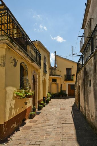 A narrow street among the old houses of Ruvo del Monte in a medieval village in the Basilicata region