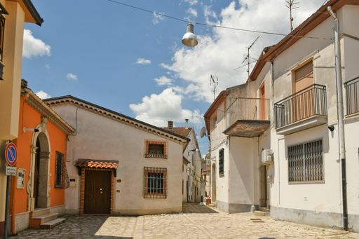 A narrow street among the old houses of Ruvo del Monte in a medieval village in the Basilicata region