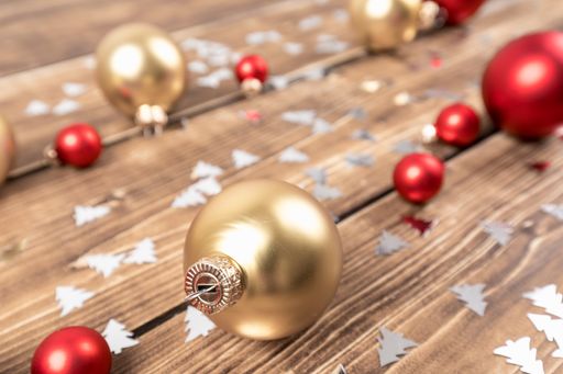 A closeup shot of a colorful Christmas decorations on a wooden table